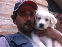 puppy snuggles with owner
